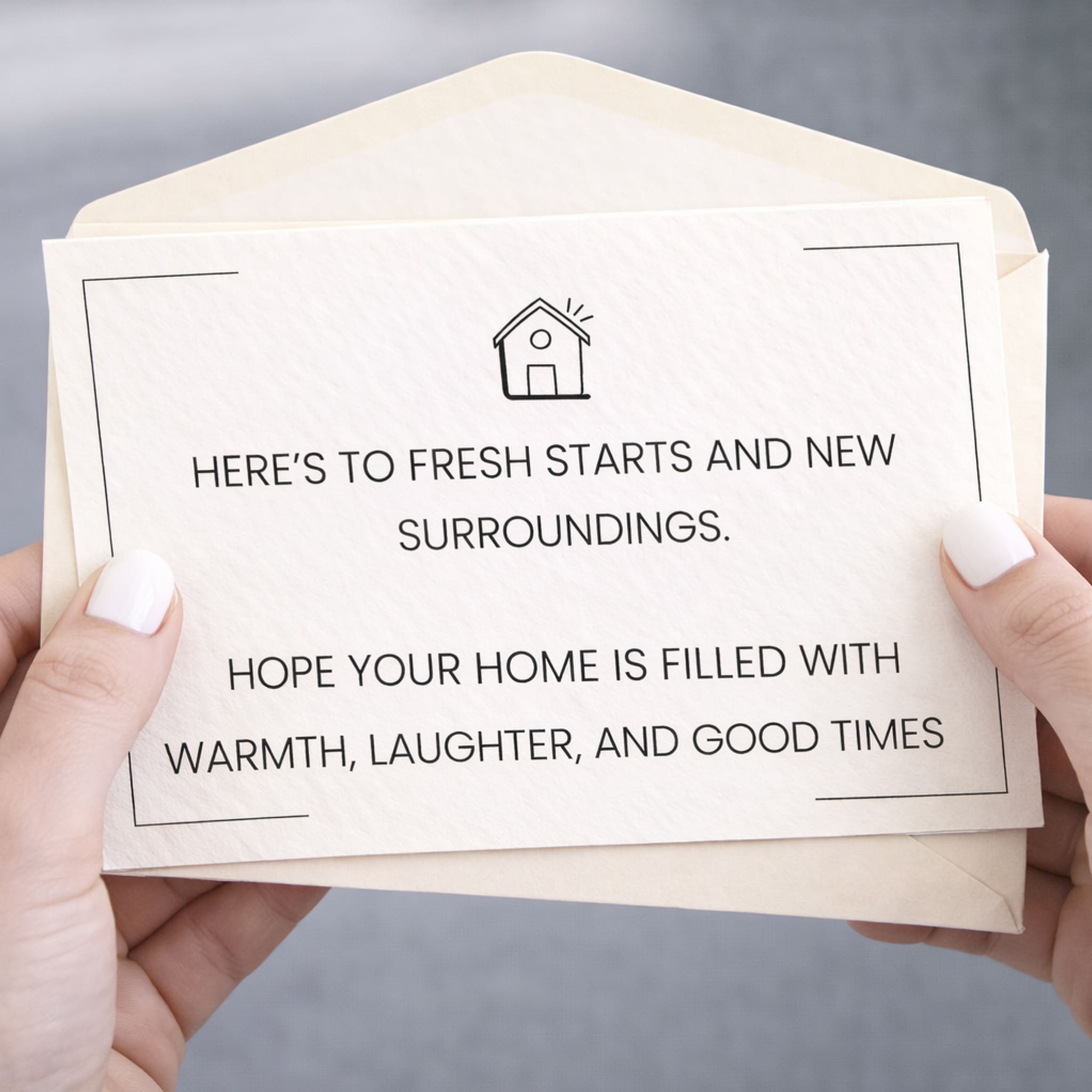 Hand holding a card with a message of congratulations on a neutral background