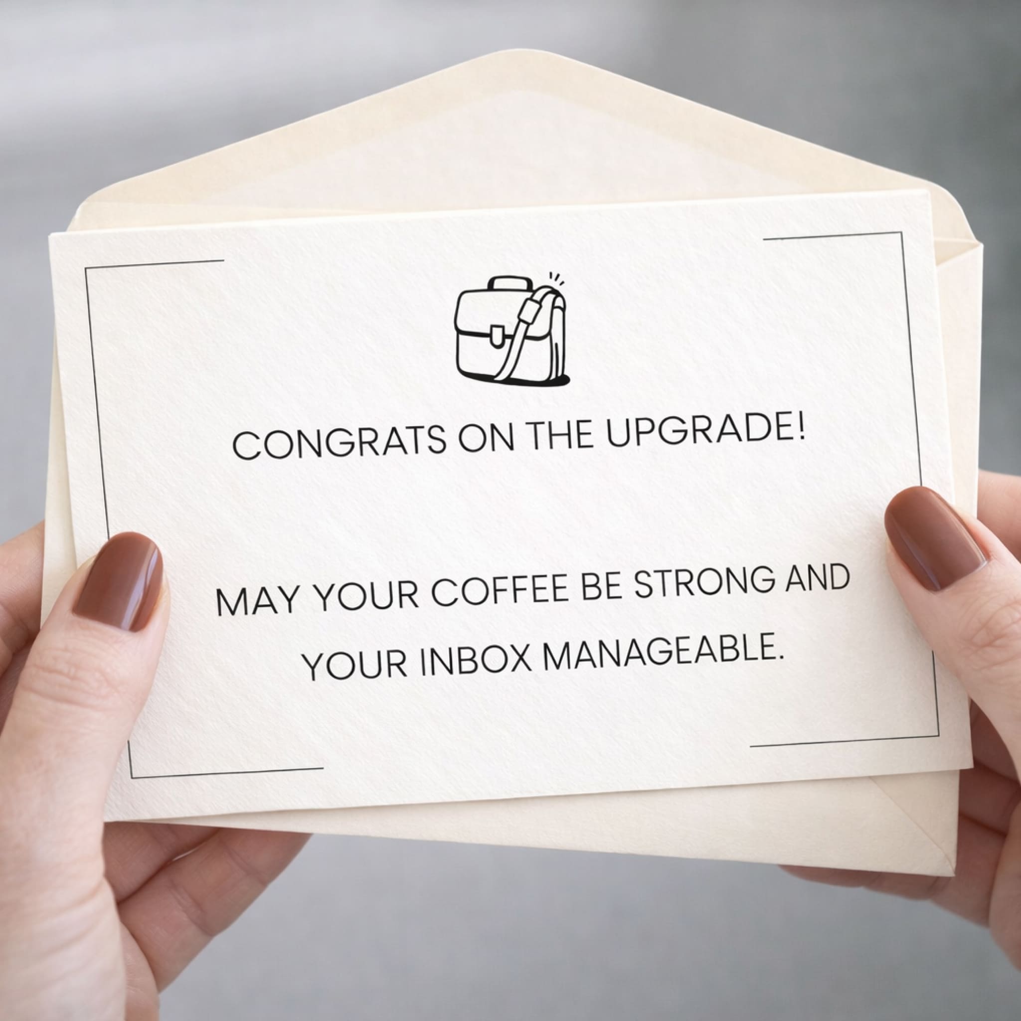 Hand holding a card with humorous upgrade message and illustration of a briefcase.